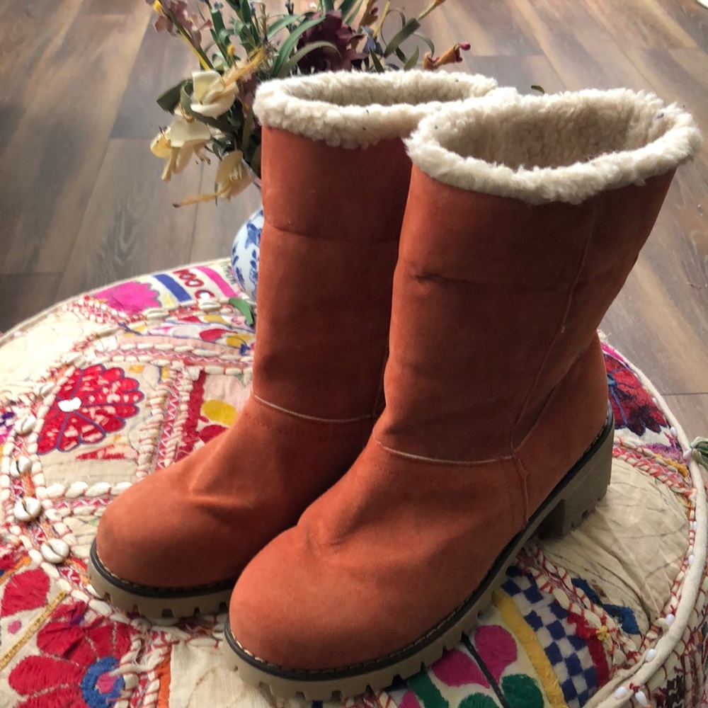 Never worn, orange, suede boots, lined inside for warmth.